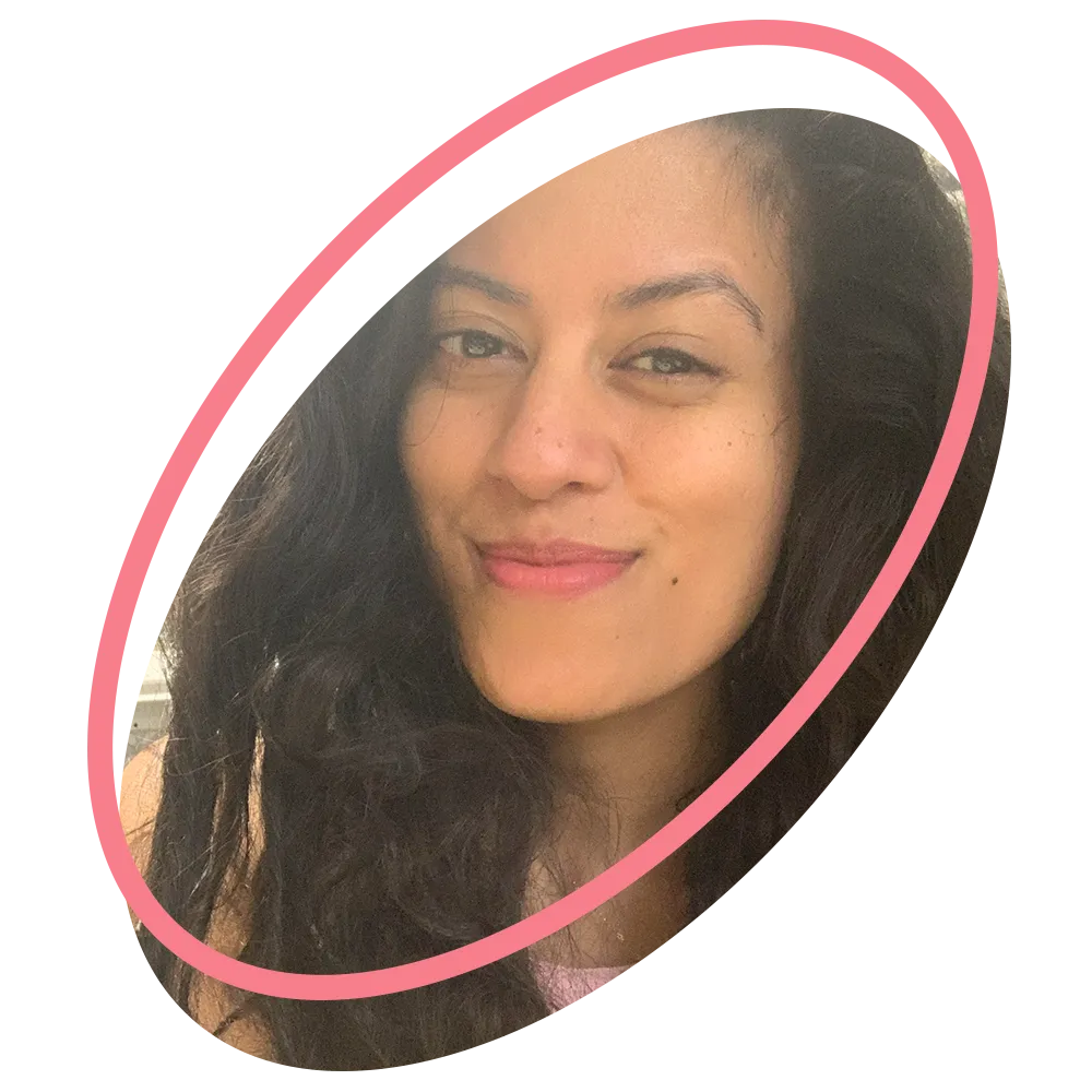 A kid proudly displaying an amazing facepaint artwork